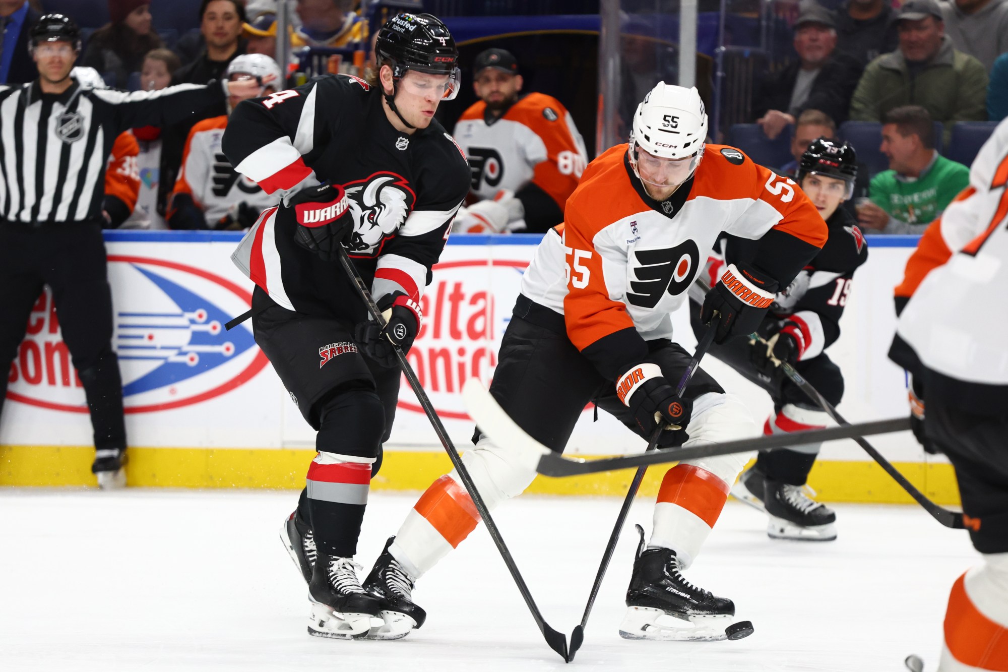 Flyers defenseman Rasmus Ristolainen, right, battles for the puck with the Sabres’ Bowen Byram during a Dec. 18 game in Buffalo. (AP Photo/Jeffrey T. Barnes)
