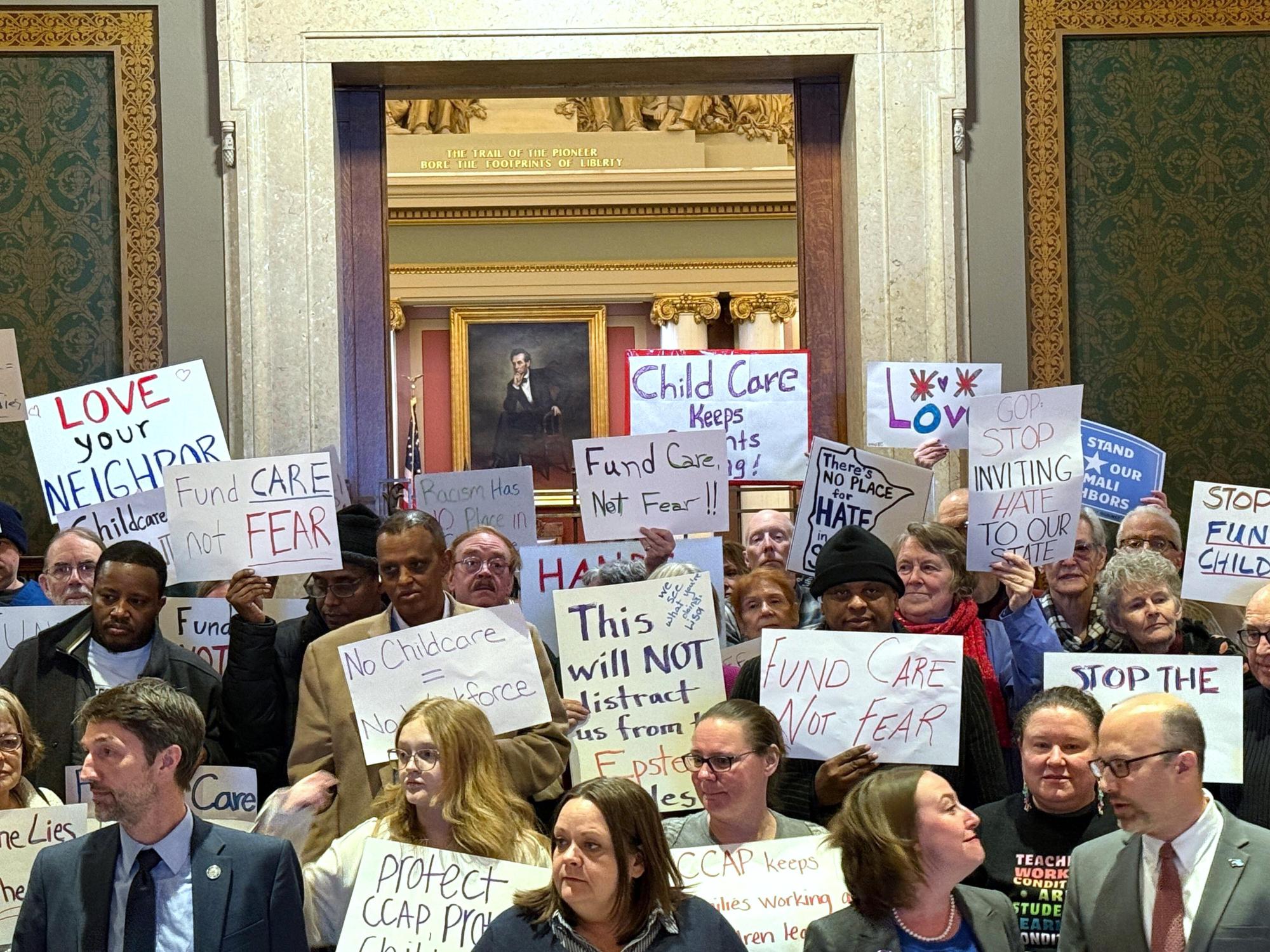 People gather for a news conference at the state capitol in St. Paul, Minn., on Wednesday, Dec. 31, 2025. (AP Giovanna Dell’Orto)
