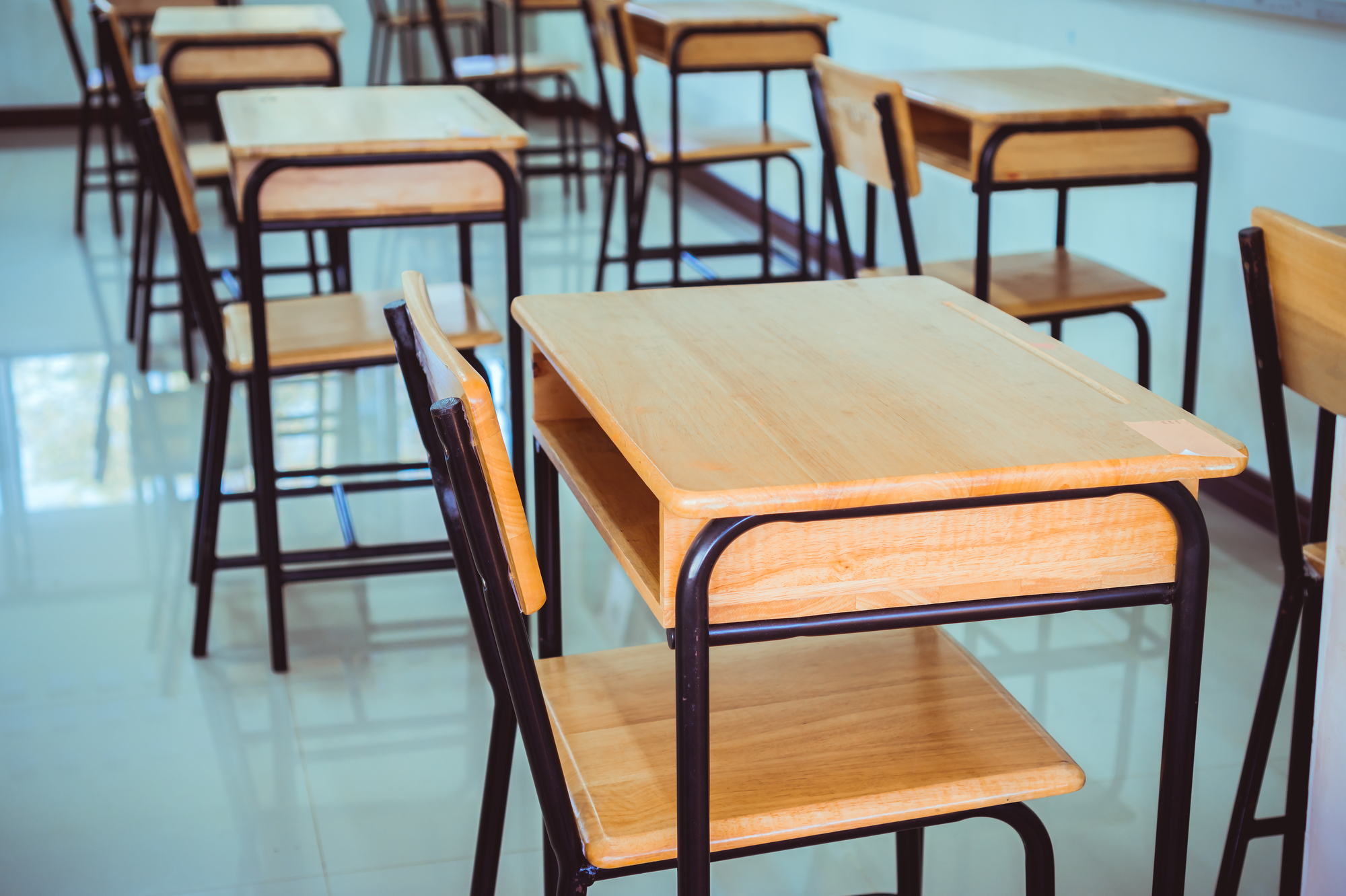 Back to school concept. School empty classroom, Lecture room with desks and chairs iron wood for studying lessons in highschool thailand without young student, interior of secondary education
