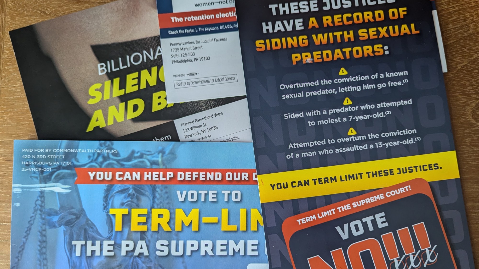 A pile of mailers intended to sway the PA Supreme Court retention races. (Sarah Anne Hughes / Spotlight PA)
